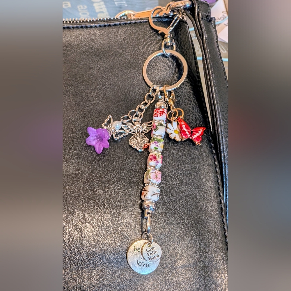Floral Charm Purse/Keychain with Butterfly & Angel Charms Says "Believe In Love"